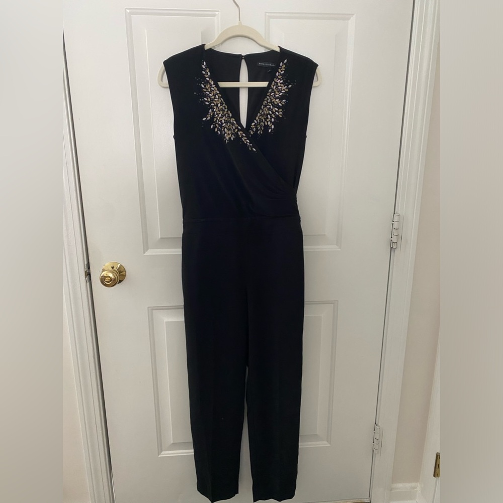 Black jumpsuit with gem design neckline